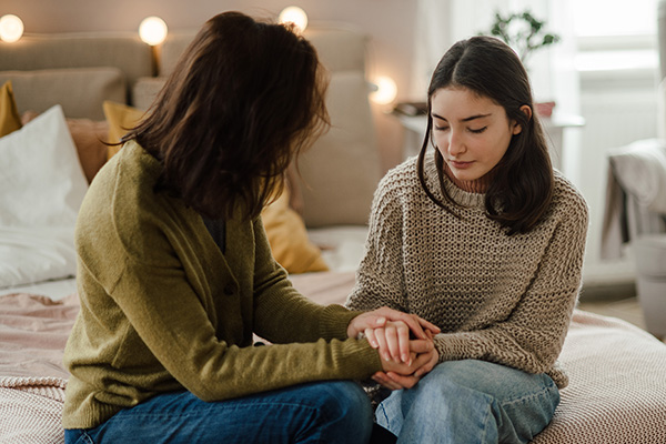 Teenage girl sharing problems with her mother