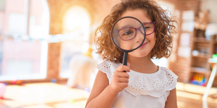 child using magnifying glass