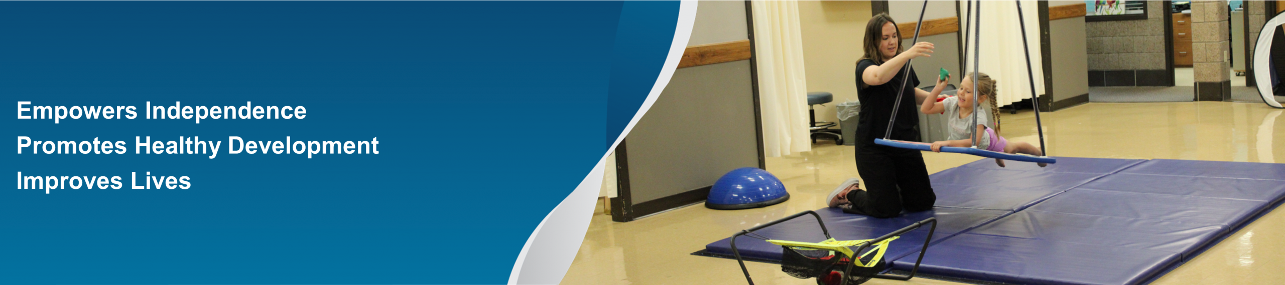 Therapist working with a girl on a swing