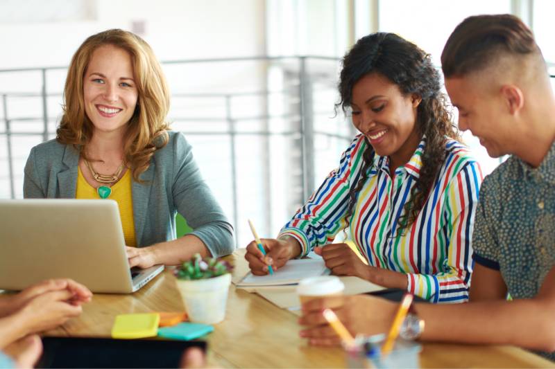 Small group of people talking at a table