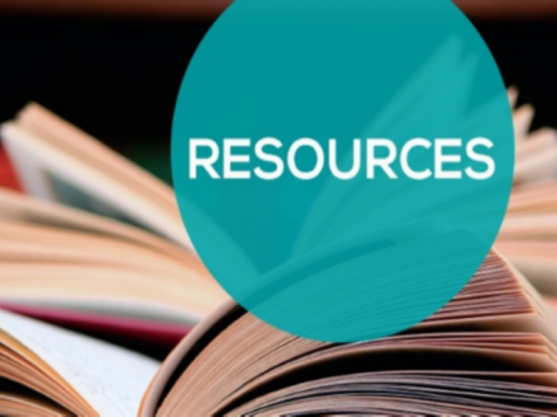 The word 'Resources' placed on a blue circle with a background of open books.