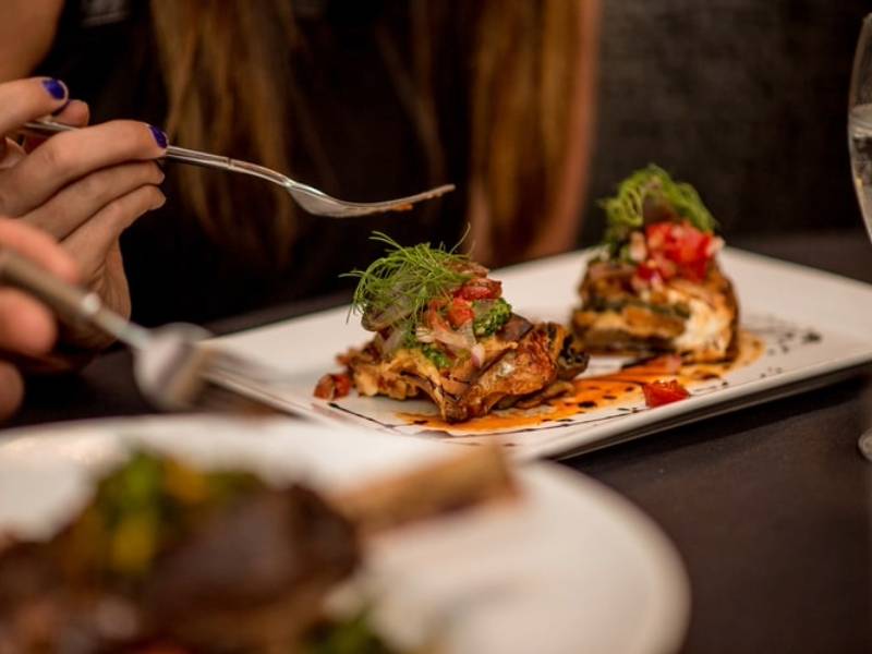 Woman with a meal at a restaurant