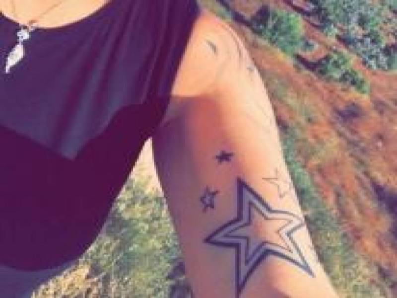 Star tattoo on an arm.
