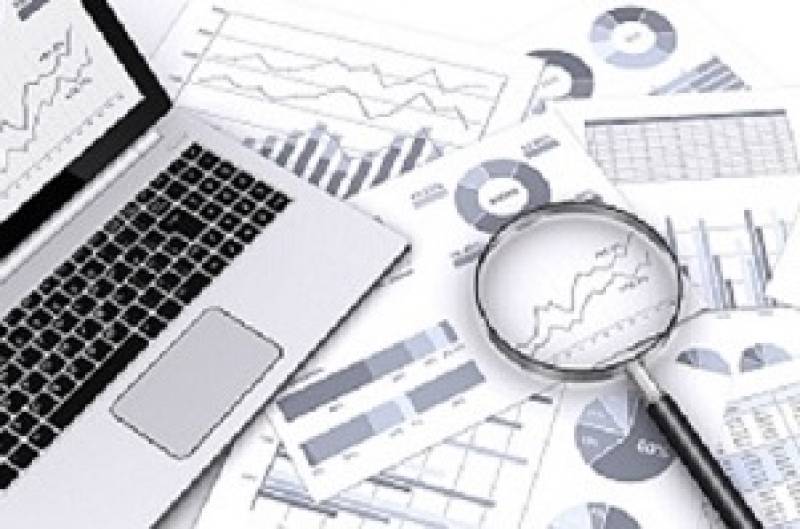 Computer and graphs with magnifying glass