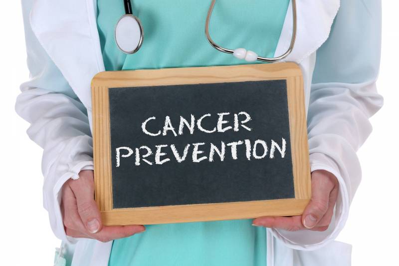 Blackboard sign stating cancer prevention