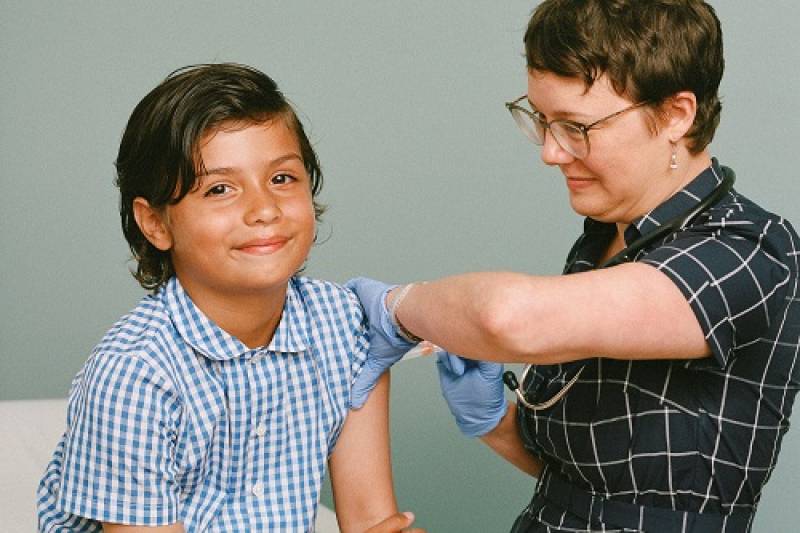 Young boy getting flu shot
