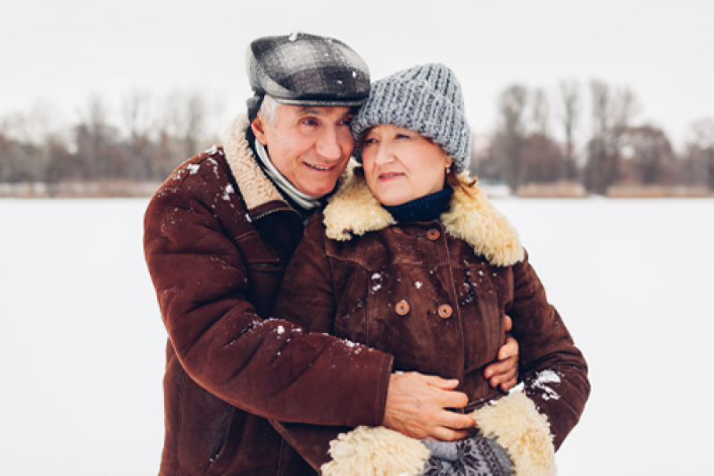Image of a man hugging a woman outside in the winter