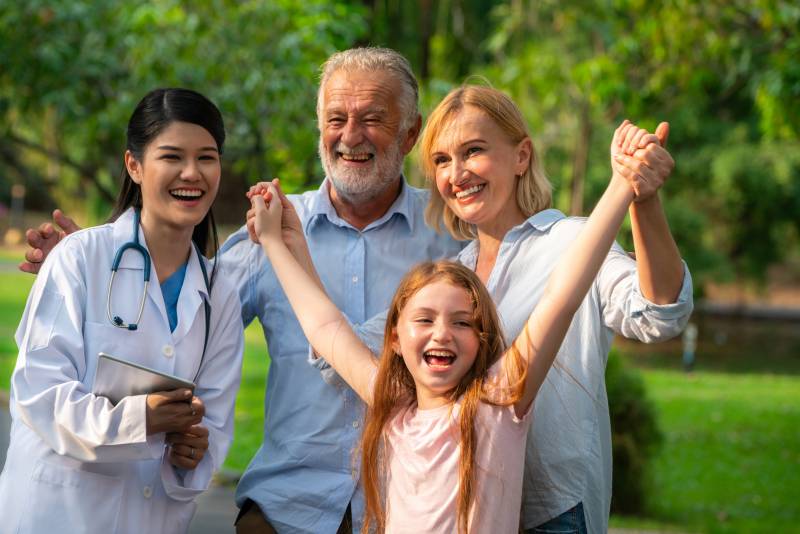 image of a nurse with a multi-generational family