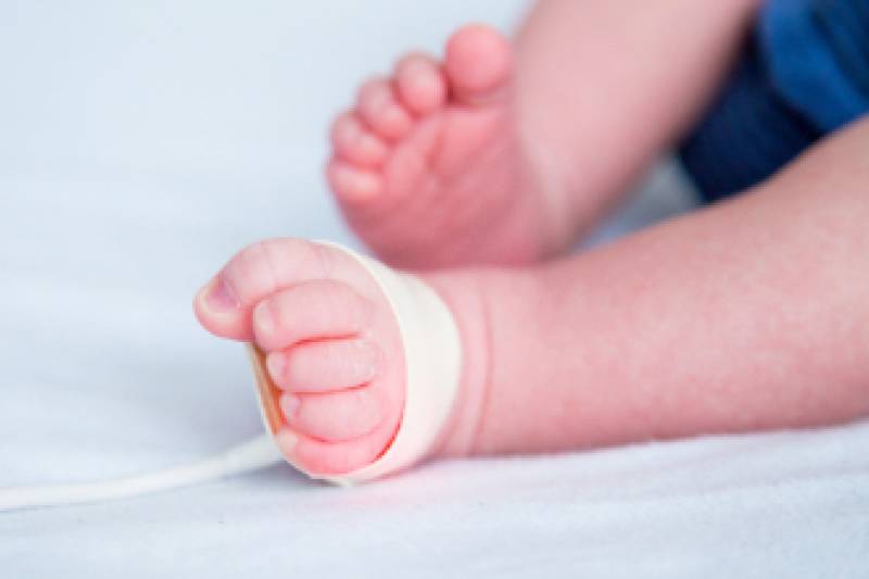 Baby feet on floor