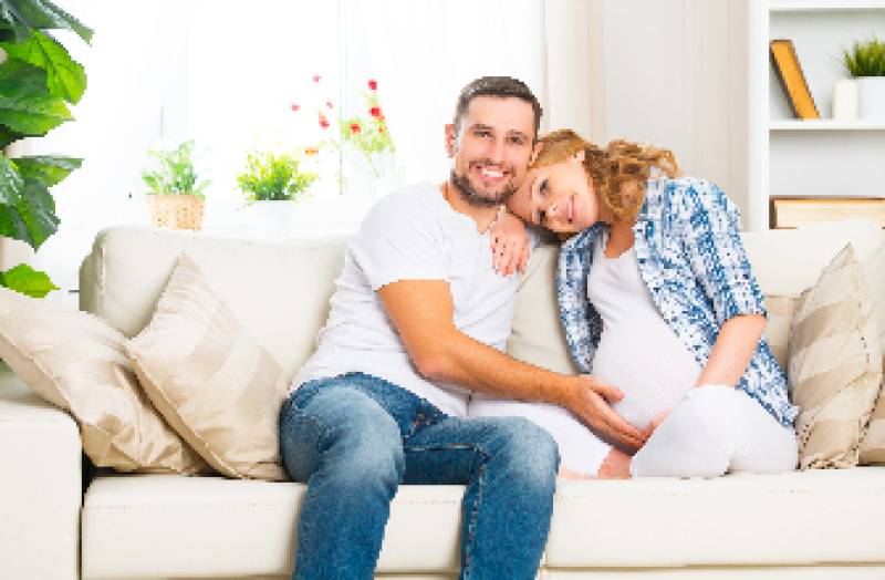 Pregnant couple smiling