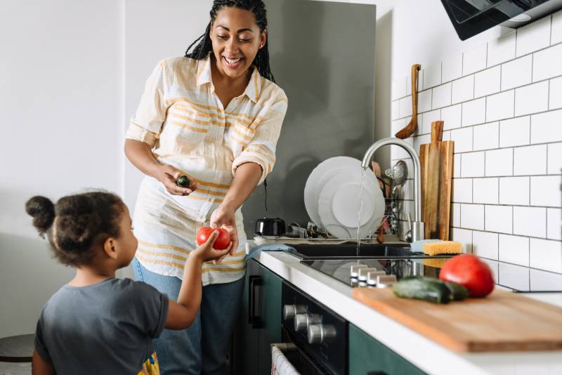 Mom and daughter washing food
