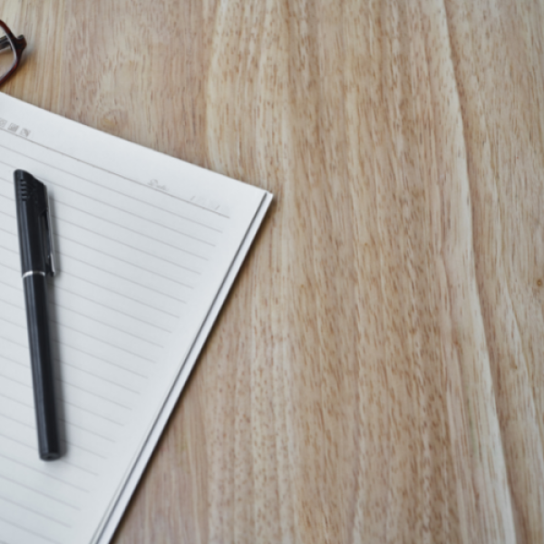 Pen and paper on desk