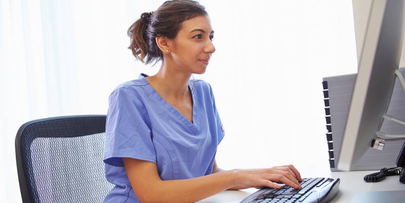 Nurse Working on a Computer