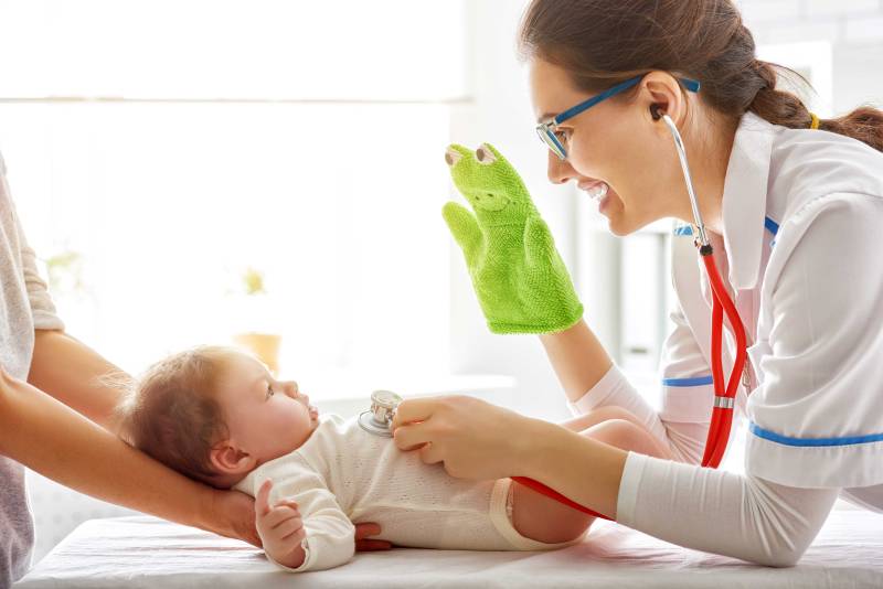 Physician Examining Baby