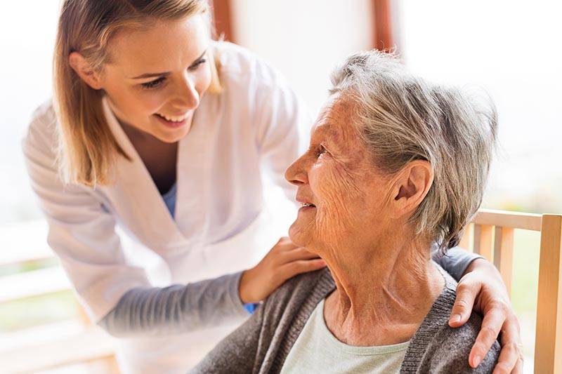 caregiver and elderly woman