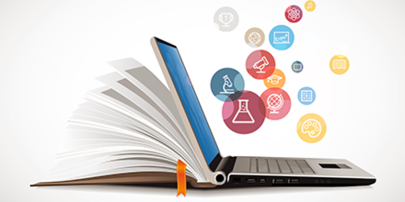 An open laptop and book with floating bubbles that have medical-based icons in them