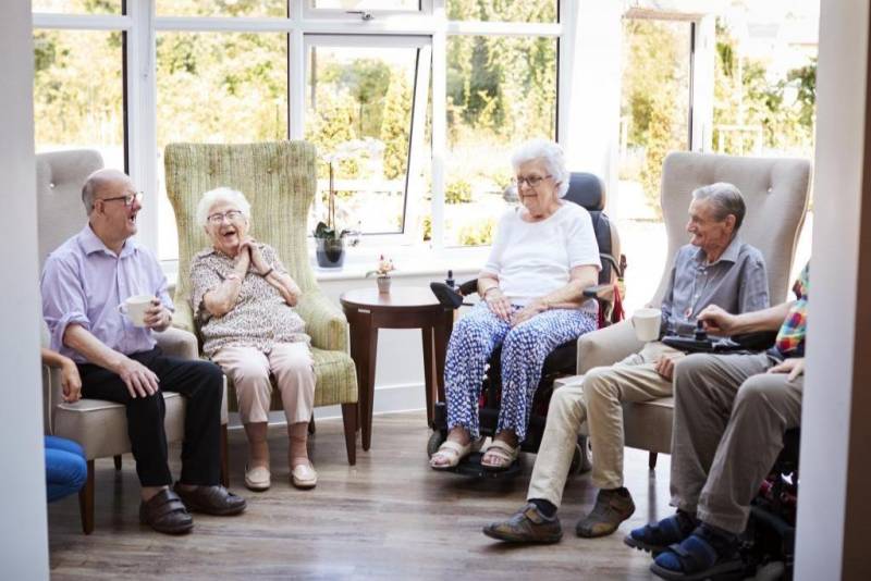 Group of elderly sitting and chatting