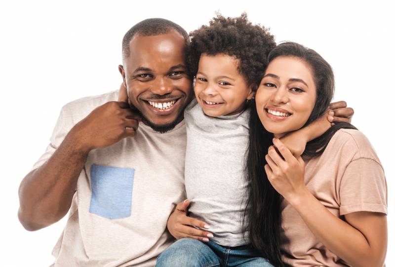 Parents and child hugging
