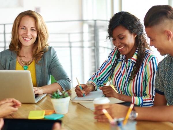 Small group of people talking at a table