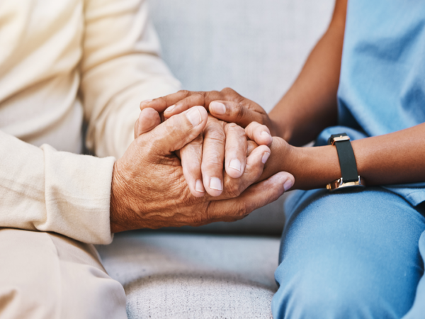 Two people holding hands