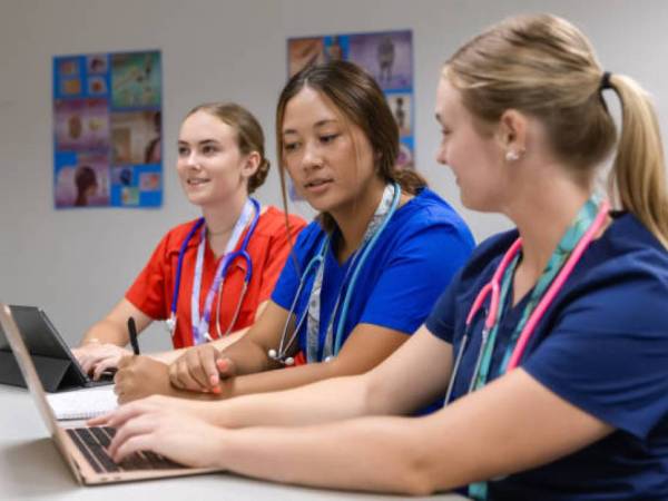 Young women attending a nurse aide training session. 