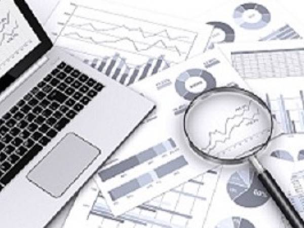 Computer and graphs with magnifying glass
