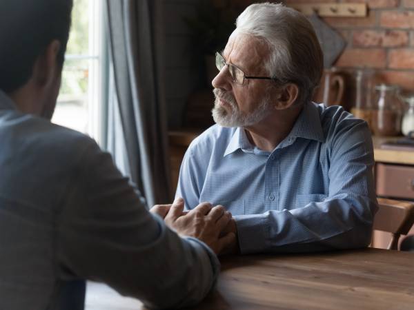 Two Men Having Conversation 