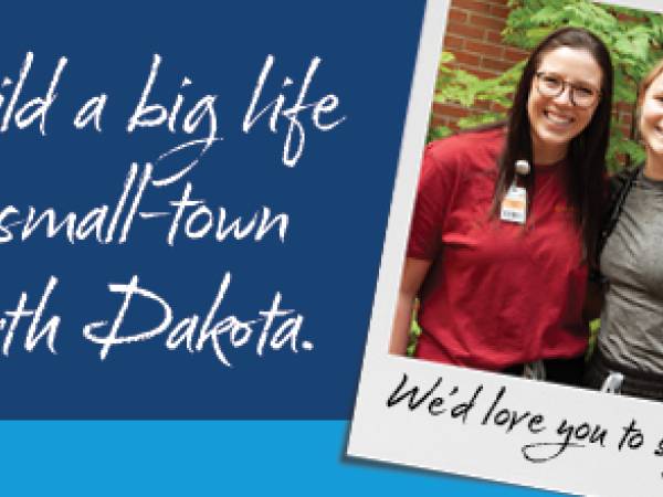 Snapshot of two women friends standing next to each other shown next to the text "Build a big life in small-town North Dakota"