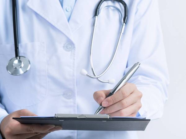 Provider with a clipboard and pen
