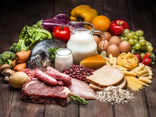 Different types of food on rustic wooden table