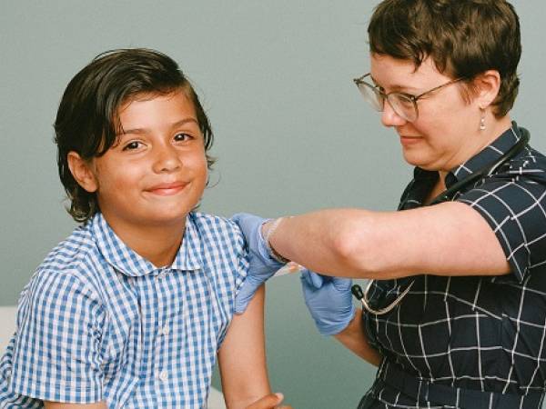 Young boy getting flu shot