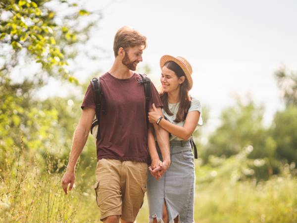 Young happy couple walking