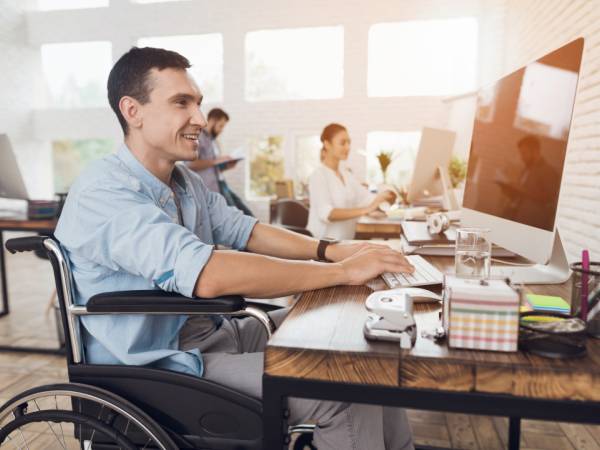 man works on a computer