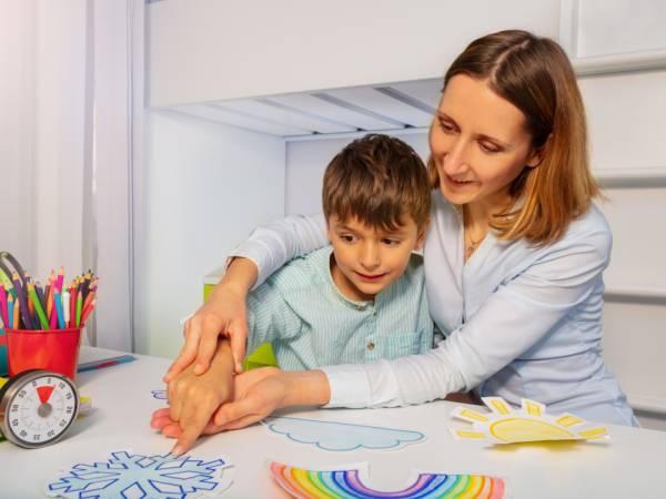 Young child learning with teacher