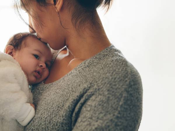 mother holding newborn baby