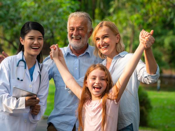 image of a nurse with a multi-generational family