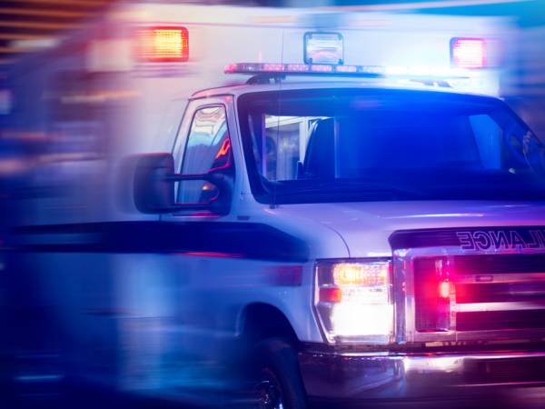 Blurred photo of ambulance with lights on