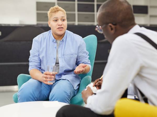 Man talking to male case manager