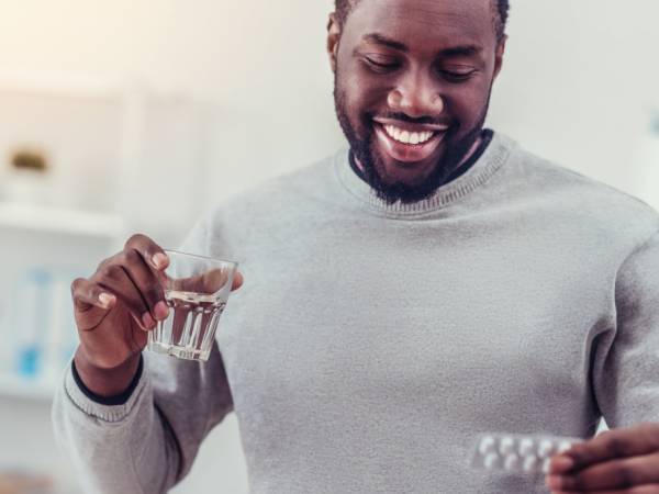 Man taking HIV oral medication 