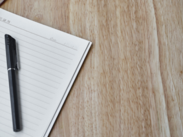 Pen and paper on desk