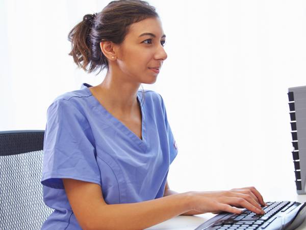 Nurse Working on a Computer