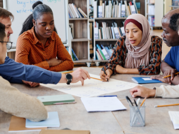 People Sitting Around a Table Learning Together