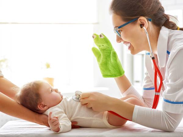 Physician Examining Baby