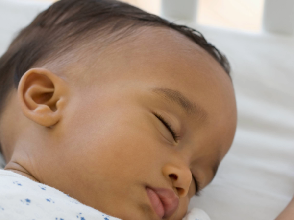 Baby sleeping in a crib