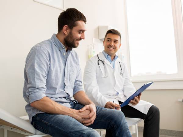 Man talking to health provider