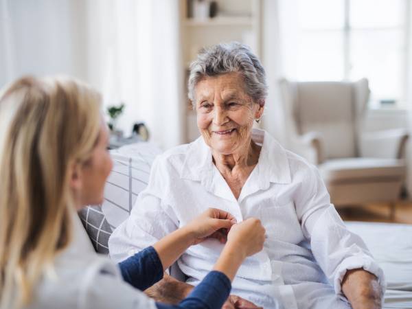 Caregiver assisting elderly