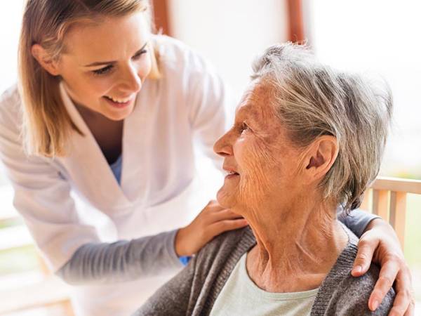 caregiver and elderly woman