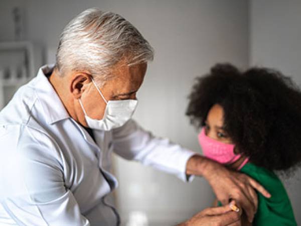 Doctor vaccinating patient