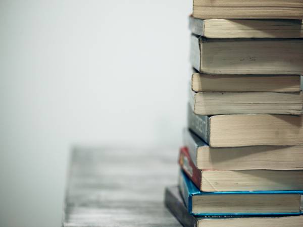 Stack of books sitting on a table