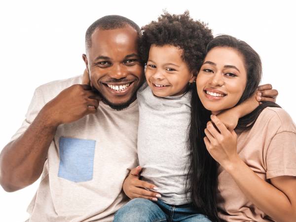 Parents and child hugging